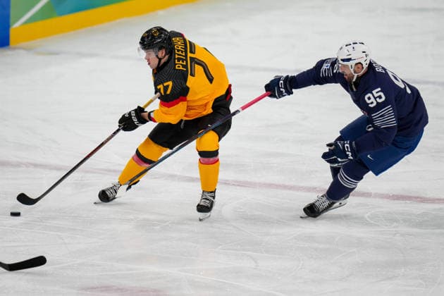 John Peterka (Germany) und Kevin Bozon (France) battle for the puck during the Ice hockey, Eishockey Men - Qualification Play-off match between Germany v France on day eleven of the Milano Cortina 2026 Winter Olympic Games, Olympische Spiele, Olympia, OS at Milano Santagiulia IHO Ice Hockey Arena on February 17, 2026 in Milan, Italy. (Photo by Alex Gottschalk DeFodi Images) - *** John Peterka Germany and Kevin Bozon France battle for the puck during the Ice Hockey Men Qualification Play off match between Germany v France on day eleven of the Milano Cortina 2026 Winter Olympic games at Milano Santagiulia IHO Ice Hockey Arena on February 17, 2026 in Milan, Italy Photo by Alex Gottschalk DeFodi Images