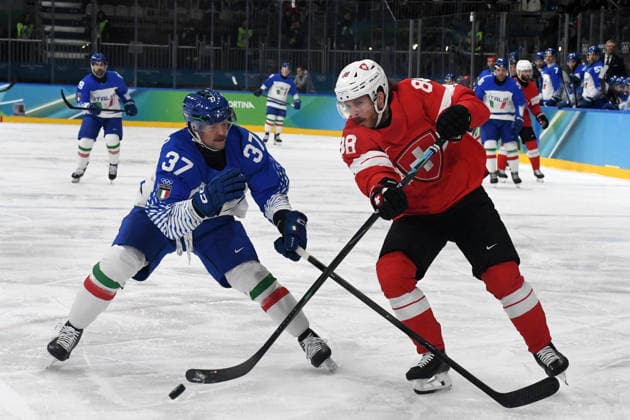 Phil Pietroniro (Italy) against Cristoph Bertschy (Suisse) during Ice hockey, Eishockey Olympic Winter games, Winterspiele,Spiele, Summer games Milano-Cortina 2026 in Milano, Italy, February 17 2026  Copyright: xPasqualexGolia IPAxSportx xipa-agency.netx xx IPA_71638675 IPA_Agency_IPA71638675