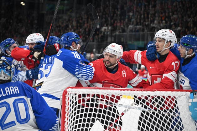 February 17, 2026, Milano, Lombardia, Italy: Italian and Swiss player fighting during the Winter Olympic Games, Olympische Spiele, Olympia, OS Milano Cortina 2026, at the Milano Rho Ice hockey, Eishockey Arena, on February 17, 2026 in Milano, Italy Milano Italy - ZUMAm345 20260217_oly_m345_020 Copyright: xFedericoxManonix