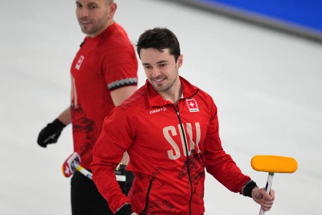 (260217) -- CORTINA D AMPEZZO, Feb. 17, 2026 -- Benoit Schwarz-van Berkel (R) of Switzerland reacts during the curling men s round robin session 9 match between Switzerland and Sweden at the 2026 Milan-Cortina Winter Olympics in Cortina, Italy, Feb. 17, 2026. ) (MICO2026)ITALY-CORTINA D AMPEZZO-OLYMPIC Winter games, Winterspiele,Spiele, Summer games CURLING-MEN-ROUND ROBIN-SUI VS SWE LixGang 