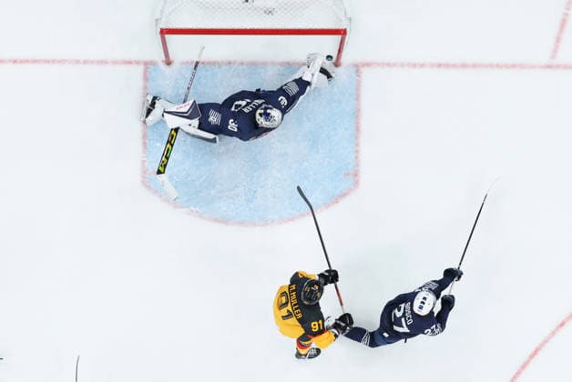 (260217) -- MILAN, Feb. 17, 2026 -- Goalkeeper Antoine Keller (top) of France makes a save during the Ice hockey, Eishockey men s qualification play-off match between Germany and France at the Milan-Cortina 2026 Olympic Winter games, Winterspiele,Spiele, Summer games in Milan, Italy, Feb. 17, 2026. ) (MICO2026)ITALY-MILAN-OLYMPIC WINTER GAMES-ICE HOCKEY-MEN-QUALIFICATION PLAY-OFF-GER VS FRA WangxKaiyan 