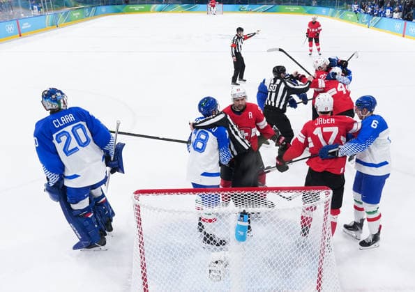 (260217) -- MILAN, Feb. 17, 2026 -- Players of Switzerland and Italy fight with each other during the Ice hockey, Eishockey men s qualification play-off match between Switzerland and Italy at the Milan-Cortina 2026 Olympic Winter games, Winterspiele,Spiele, Summer games in Milan, Italy, Feb. 17, 2026. ) (MICO2026)ITALY-MILAN-OLYMPIC WINTER GAMES-ICE HOCKEY-MEN-QUALIFICATION PLAY-OFF-SUI VS ITA TaoxXiyi 