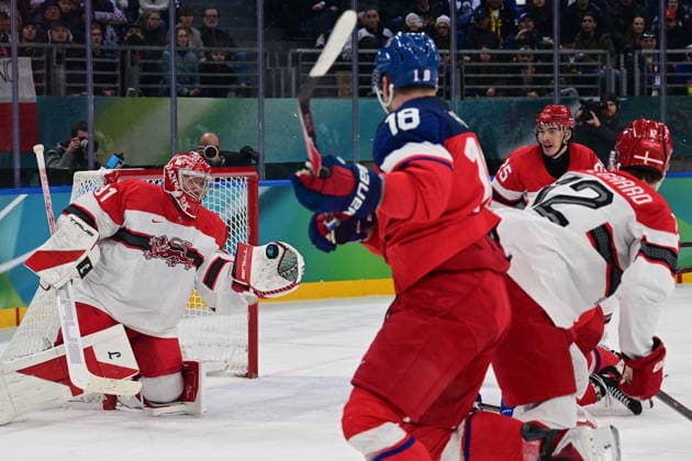 XXV Winter Olympic Games, Olympische Spiele, Olympia, OS in Milan, Italy, on February 17, 2026. Men s Ice hockey, Eishockey preliminary round playoffs, Czechia - Denmark. From left: Frederik Andersen of Denmark, Ondrej Palat of the Czech Republic, Oliver Lauridsen of Denmark and Oscar Fisker Molgaard of Denmark. (CTKxPhoto MichalxKamaryt) CTKPhotoP2026021707166  CTKPhotoP2026021707166