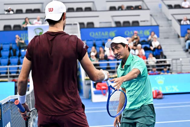 February 17, 2026, Doha, Qatar: Shintaro Mochizuki (R) of Japan and Karen Khachanov of Russia seen during the Round of 32 at the ATP, Tennis Herren men™s Qatar ExxonMobil Open 2026 tennis tournament at the Khalifa International Tennis Complex. Karen Khachanov won against Shintaro Mochizuki 6-1,3-6,6-4. QTF ATP QATAR EXXONMOBIL OPEN-ROUND OF 32 - 17 Feb 2026  - ZUMAs197 20260217_aaa_s197_136 Copyright: xNoushadxVariyattiyakkalx