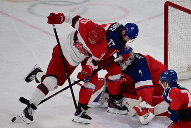 XXV Winter Olympic Games, Olympische Spiele, Olympia, OS in Milan, Italy, on February 17, 2026. Men s Ice hockey, Eishockey preliminary round playoffs, Czechia - Denmark. From left: Lars Eller of Denmark, Filip Hronek of the Czech Republic, goalie Lukas Dostal of the Czech Republic, Ondrej Kase of the Czech Republic. (CTKxPhoto MichalxKamaryt) CTKPhotoP2026021707576  CTKPhotoP2026021707576