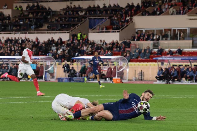 Monaco, Monaco, 17th February 2026. Khvicha Kvaratskhelia of PSG is brought down in the area by Wout Faes of AS Monaco to earn a penalty only for the shot to be saved by Philipp Kohn of AS Monaco during the AS Monaco vs Paris Saint Germain UEFA Champions League match at Stade Louis II, Monaco. Picture credit should read: Jonathan Moscrop Sportimage EDITORIAL USE ONLY. No use with unauthorised audio, video, data, fixture lists, club league logos or live services. Online in-match use limited to 120 images, no video emulation. No use in betting, games or single club league player publications. SPI_005_MONACO_PSG_UCL_ SPI-4526-0005
