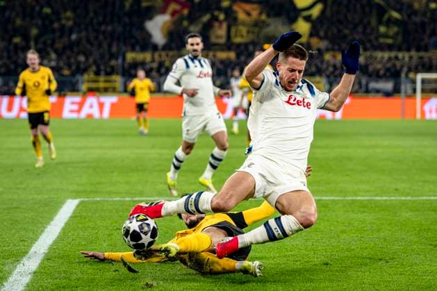 Atalanta midfielder Mario Pasalic, Borussia Dortmund defender Ramy Bensebaini, during the match Borussia Dortmund vs Atalanta BC at the BVB Stadion Dortmund for the Champions League KO play offs 1st leg season 2025 2026 in DORTMUND, Germany on 17 february 2026 Photo by Stefan Koops EYE4IMAGES DeFodi Images