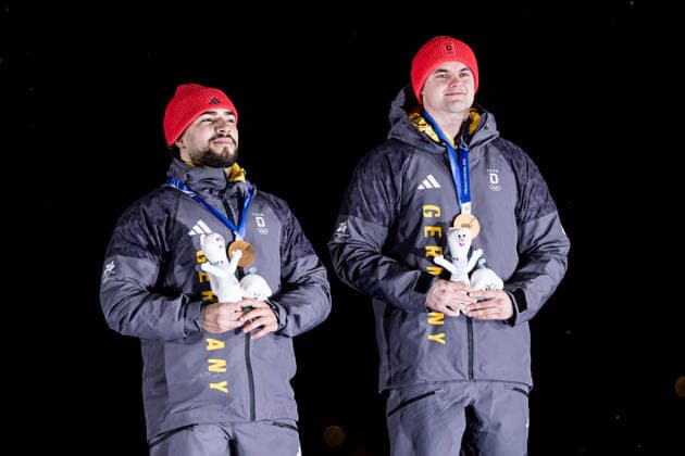 CORTINA, ITALY - FEBRUARY 17: Bronze medalists Adam Ammour and Alexander Schaller (Germany) during the Bobsleigh 2-man medal ceremony at the Milano Cortina 2026 Olympics at Cortina Sliding Centre on day 11 of the Milano Cortina 2026 Olympics on February 17, 2026 in Cortina, Italy. Editorial use only. Italy Copyright: xSteffiexWunderlx