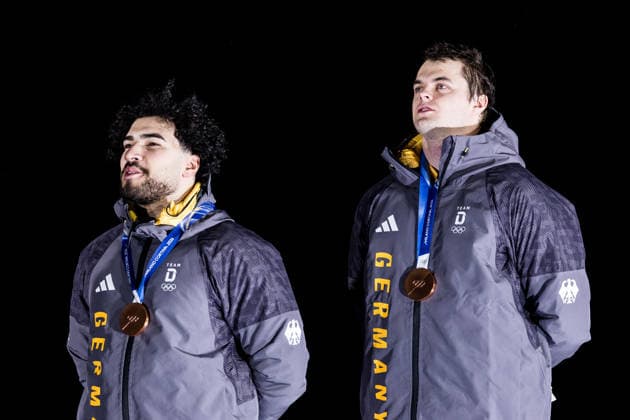 CORTINA, ITALY - FEBRUARY 17: Bronze medalists Adam Ammour and Alexander Schaller (Germany) during the Bobsleigh 2-man medal ceremony at the Milano Cortina 2026 Olympics at Cortina Sliding Centre on day 11 of the Milano Cortina 2026 Olympics on February 17, 2026 in Cortina, Italy. Editorial use only. Italy Copyright: xSteffiexWunderlx
