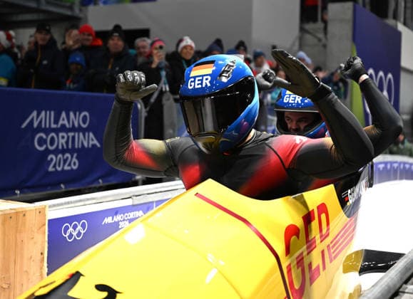 (260218) -- CORTINA D AMPEZZO, Feb. 18, 2026 -- Adam Ammour (L) Alexander Schaller of Germany react during the Bobsleigh 2-man heat 4 at the Milan-Cortina 2026 Olympic Winter games, Winterspiele,Spiele, Summer games in Cortina D Ampezzo, Italy, Feb. 17, 2026. ) (MICO2026)ITALY-CORTINA D AMPEZZO-OLYMPIC WINTER GAMES-BOBSLEIGH-2-MAN LianxYi 