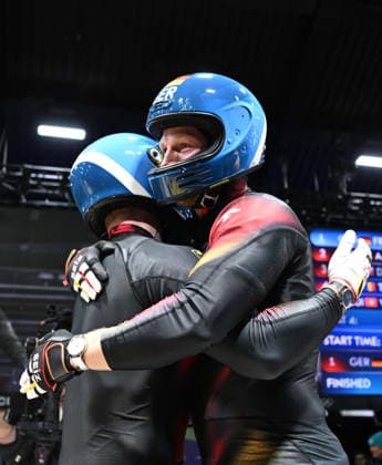 (260218) -- CORTINA D AMPEZZO, Feb. 18, 2026 -- Francesco Friedrich (L) Alexander Schuller of Germany hug after the Bobsleigh 2-man heat 4 at the Milan-Cortina 2026 Olympic Winter games, Winterspiele,Spiele, Summer games in Cortina D Ampezzo, Italy, Feb. 17, 2026. ) (MICO2026)ITALY-CORTINA D AMPEZZO-OLYMPIC WINTER GAMES-BOBSLEIGH-2-MAN LianxYi 
