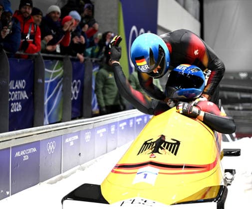 (260218) -- CORTINA D AMPEZZO, Feb. 18, 2026 -- Johannes Lochner (front) Georg Fleischhauer of Germany celebrate after winning the Bobsleigh 2-man at the Milan-Cortina 2026 Olympic Winter games, Winterspiele,Spiele, Summer games in Cortina D Ampezzo, Italy, Feb. 17, 2026. ) (MICO2026)ITALY-CORTINA D AMPEZZO-OLYMPIC WINTER GAMES-BOBSLEIGH-2-MAN LianxYi 
