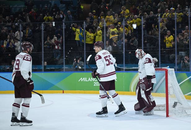 (260218) -- MILAN, Feb. 18, 2026 -- Players of Latvia react after the Ice hockey, Eishockey men s qualification play-off match between the Sweden and Latvia at the Milan-Cortina 2026 Olympic Winter games, Winterspiele,Spiele, Summer games in Milan, Italy, Feb. 17, 2026. ) (MICO2026)ITALY-MILAN-OLYMPIC WINTER GAMES-ICE HOCKEY-MEN-QUALIFICATION PLAY-OFF-SWE VS LAT ZhangxHaofu 
