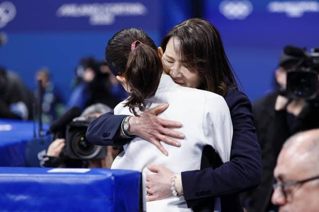 Milan Cortina Olympics: Figure skating, Eiskunstlauf Mone Chiba of Japan is hugged by her coach Mie Hamada (facing camera) after performing in the women s figure skating short program at the Milan Cortina Olympics at Milano Ice Skating Arena in Milan on Feb. 17, 2026.  A14AA0005298515P