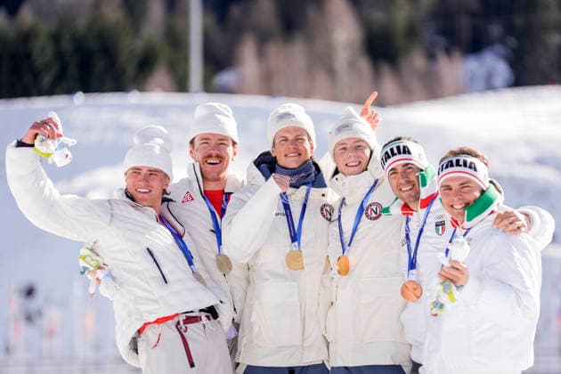 Winter Olympics in Milan Cortina 2026 Val di Fiemme, Italy 20260218. Ben Ogden and Gus Schumacher from the USA, Johannes Hosflot Klaebo and Einar Hedegart from Norway, Federico Pellegrino and Elia Barp from Italy on the podium after the cross-country team sprint at Lago di Tesero during the Winter Olympics in Milano Cortina 2026. Photo: Terje Pedersen NTB Val di Fiemme Italy EDITORIAL USE ONLY. RESTRICTED USE FOR BETTING COMPANIES Ref:_SPO3wEfzbxDQoA.jpg *** Winter Olympics in Milan Cortina 2026 Val di Fiemme, Italy 20260218 Ben Ogden and Gus Schumacher from the USA, Johannes Hosflot Klaebo and Einar Hedegart from Norway, Federico Pellegrino and Elia Barp from Italy on the podium after the cross country team sprint at Lago di Tesero during the Winter Olympics in Milano Cortina 2026 Photo Terje Pedersen NTB Val di Fiemme Italy EDITORIAL USE ONLY RESTRICTED USE FOR BETTING COMPANIES  Copyright: xTerjexPedersenx xNTBx