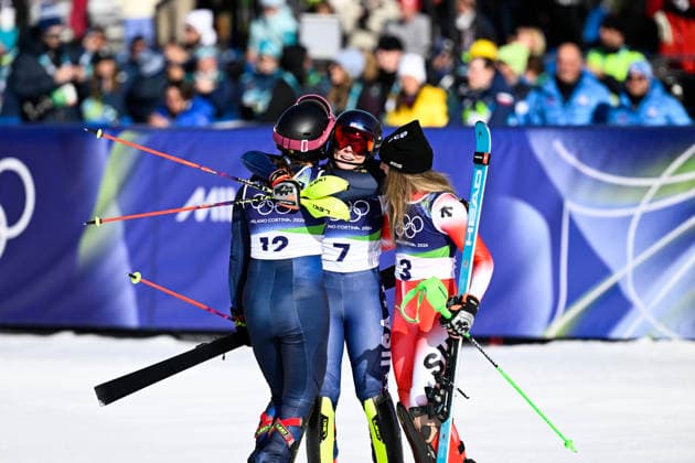 CORTINA, ITALY 20260218 USA s Mikaela Shiffrin is hugged after winning gold by Sweden s Anna Swenn-Larsson, who won bronze, and Switzerland s Camille Rast, who won silver, during the second run of the women s slalom in Cortina during the Winter Olympics in Milan Cortina, Italy. *** The image is included in the SPORTS PACKAGE. For others PAYMENT IMAGE *** CORTINA ITALY x10050x *** CORTINA, ITALY 20260218 USA s Mikaela Shiffrin is hugged after winning gold by Sweden s Anna Swenn Larsson, who won bronze, and Switzerland s Camille Rast, who won silver, during the second run of the women s slalom in Cortina during the Winter Olympics in Milan Cortina, Italy The image is included in the SPORTS PACKAGE For others PAYMENT IMAGE CORTINA ITALY x10050x  Copyright: xPontusxLundahl TTx 2026 OLYMPICS ALPINE WOMEN S SLALOM