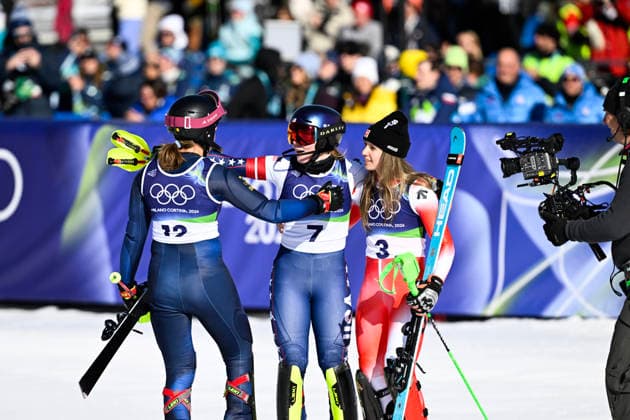 CORTINA, ITALY 20260218 USA s Mikaela Shiffrin is hugged after winning gold by Sweden s Anna Swenn-Larsson, who won bronze, and Switzerland s Camille Rast, who won silver, during the second run of the women s slalom in Cortina during the Winter Olympics in Milan Cortina, Italy. *** The image is included in the SPORTS PACKAGE. For others PAYMENT IMAGE *** CORTINA ITALY x10050x *** CORTINA, ITALY 20260218 USA s Mikaela Shiffrin is hugged after winning gold by Sweden s Anna Swenn Larsson, who won bronze, and Switzerland s Camille Rast, who won silver, during the second run of the women s slalom in Cortina during the Winter Olympics in Milan Cortina, Italy The image is included in the SPORTS PACKAGE For others PAYMENT IMAGE CORTINA ITALY x10050x  Copyright: xPontusxLundahl TTx 2026 OLYMPICS ALPINE WOMEN S SLALOM