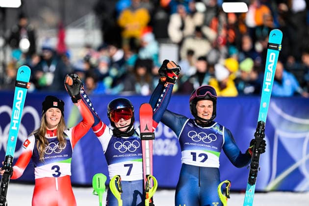 CORTINA, ITALY 20260218 USA s Mikaela Shiffrin is hugged after winning gold by Sweden s Anna Swenn-Larsson, who won bronze, and Switzerland s Camille Rast, who won silver, during the second run of the women s slalom in Cortina during the Winter Olympics in Milan Cortina, Italy. *** The image is included in the SPORTS PACKAGE. For others PAYMENT IMAGE *** CORTINA ITALY x10050x *** CORTINA, ITALY 20260218 USA s Mikaela Shiffrin is hugged after winning gold by Sweden s Anna Swenn Larsson, who won bronze, and Switzerland s Camille Rast, who won silver, during the second run of the women s slalom in Cortina during the Winter Olympics in Milan Cortina, Italy The image is included in the SPORTS PACKAGE For others PAYMENT IMAGE CORTINA ITALY x10050x  Copyright: xPontusxLundahl TTx 2026 OLYMPICS ALPINE WOMEN S SLALOM