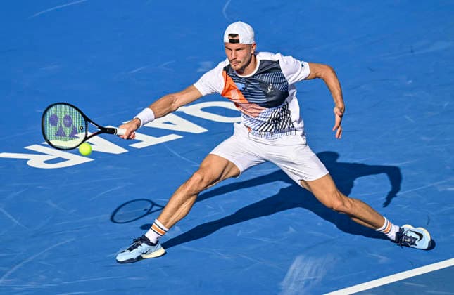 ATP, Tennis Herren QATAR EXXONMOBIL OPEN-ROUND OF Marton Fucsovics of Hungary competes against Karen Khachanov of Russia during their men s singles round of 16 match at the ATP Qatar Exxonmobil Open 2026 tennis tournament at the Khalifa International Tennis Complex in Doha, Qatar, on February 18, 2026. DOHA Qatar Copyright: xNOUSHADx