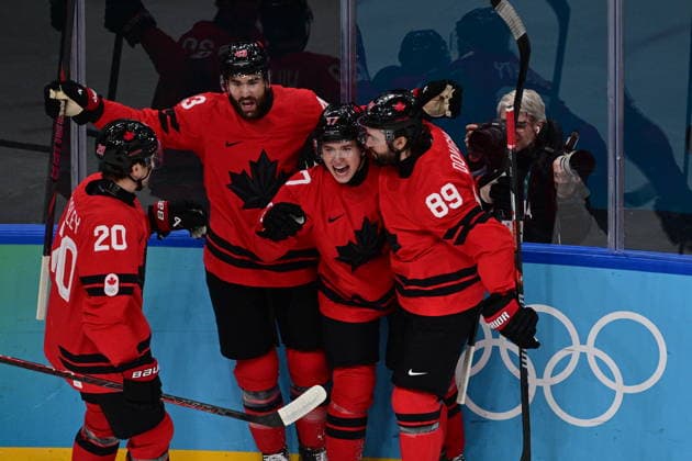 XXV Winter Olympic Games, Olympische Spiele, Olympia, OS in Milan, Italy, on February 18, 2026. Men s Ice hockey, Eishockey preliminary round playoffs, Czech Republic vs. Canada. Macklin Celebrini of Canada, 2nd right, celebrates goal. (CTKxPhoto MichalxKamaryt) CTKPhotoP2026021807816  CTKPhotoP2026021807816