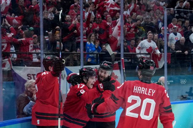 February 18, 2026, Milan, ITALY: Canada s Macklin Celebrini (17) celebrates his goal with Canada s Tom Wilson (43), Drew Doughty (89) and Thomas Harley (20) during the first period of a quarterfinal men s hockey game against Czechia at the 2026 Winter Olympics, in Milan, on Wednesday, Feb. 18, 2026. Canada News - February 18, 2026  - ZUMAc35_ 20260218_zaf_c35_070 Copyright: xDarrylxDyckx