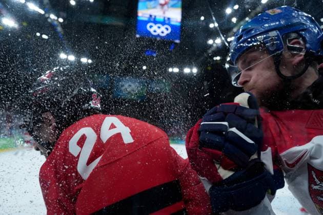 February 18, 2026, Milan, ITALY: Czechia s Jan Rutta (44) checks Canada s Seth Jarvis (24) during the first period of a quarterfinal men s hockey game at the 2026 Winter Olympics, in Milan, on Wednesday, Feb. 18, 2026. Canada News - February 18, 2026  - ZUMAc35_ 20260218_zaf_c35_072 Copyright: xDarrylxDyckx