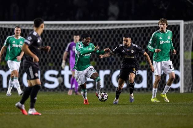 Anthony Elanga of Newcastle United Football Club runs with the ball as he is pressed by Leandro Andrade of Qarabag FK Qarabag v Newcastle United, UEFA Champions League, Knockout Round Play-Offs, First Leg, Football, Tofig Bahramov Republican Stadium, Baku, Azerbaijan - 18 Feb 2026Baku Tofig Bahramov Republican Stadiu Azerbaijan EDITORIAL USE ONLY No use with unauthorised audio, video, data, fixture lists, club league logos or live services. Online in-match use limited to 120 images, no video emulation. No use in betting, games or single club league player publications.  Copyright: xElmirxKarimov Shutterstockx 16660416ak