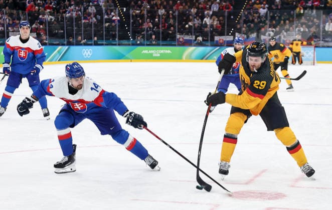 (260218) -- MILAN, Feb. 18, 2026 -- Leon Draisaitl (R) of Germany shoots during the Ice hockey, Eishockey men s play-offs quarterfinal between the Slovakia and Germany at the Milan-Cortina 2026 Olympic Winter games, Winterspiele,Spiele, Summer games in Milan, Italy, Feb. 18, 2026. ) (MICO2026)ITALY-MILAN-OLYMPIC WINTER GAMES-ICE HOCKEY-MEN-PLAY-OFFS QUARTERFINALS-SVK VS GER WangxKaiyan 