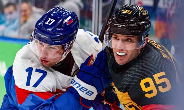 (260218) -- MILAN, Feb. 18, 2026 -- Frederik Tiffels (R) of Germany vies with Simon Nemec of Slovakia during the Ice hockey, Eishockey men s play-offs quarterfinal between the Slovakia and Germany at the Milan-Cortina 2026 Olympic Winter games, Winterspiele,Spiele, Summer games in Milan, Italy, Feb. 18, 2026. ) (MICO2026)ITALY-MILAN-OLYMPIC WINTER GAMES-ICE HOCKEY-MEN-PLAY-OFFS QUARTERFINALS-SVK VS GER WangxKaiyan 