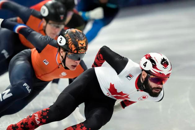 Steven Dubois, 4, of Canada holds the lead during the Men s Short Track Speed skating, Eisschnelllauf 500m Semifinals at the Milano Figure skating, Eiskunstlauf Arena in Milan, Italy on Wednesday, February 18, 2026.  OLY20260218111 RICHARDxELLIS