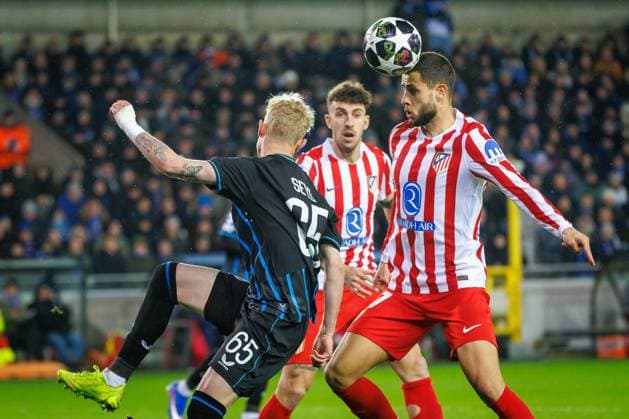 Club s Joaquin Seys and Atletico Madrid s David Hancko fight for the ball during a soccer game between Belgian Club Brugge KV and Spanish Atletico de Madrid, in Brugge on Wednesday 18 February 2026, the first leg of the play-offs for the knockout phase of the UEFA Champions League tournament. KURTxDESPLENTER  x164158226x