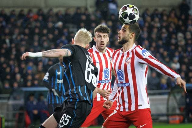 Club s Joaquin Seys and Atletico Madrid s David Hancko fight for the ball during a soccer game between Belgian Club Brugge KV and Spanish Atletico de Madrid, in Brugge on Wednesday 18 February 2026, the first leg of the play-offs for the knockout phase of the UEFA Champions League tournament. KURTxDESPLENTER  x164158234x