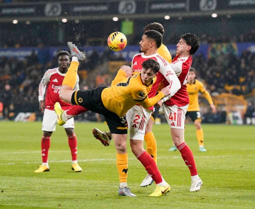 Wolverhampton, England, 18th February 2026. Ladislav Krejci of Wolverhampton Wanderers attempts a scorpion kick during the Wolverhampton Wanderers vs Arsenal Premier League match at Molineux, Wolverhampton. Picture credit should read: Andrew Yates Sportimage EDITORIAL USE ONLY. No use with unauthorised audio, video, data, fixture lists, club league logos or live services. Online in-match use limited to 120 images, no video emulation. No use in betting, games or single club league player publications. SPI_026_AY_Wolves_Arsenal SPI-4539-0028