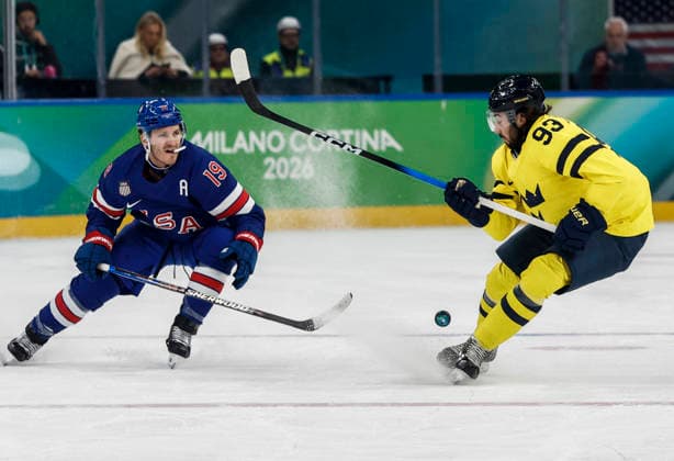 United States Matthew Tkachuk (19) and Sweden s Mika Zibanejad (93) battle for the puck in the first period of the Men s Hockey Playoff Quarter-final game between Sweden and the USA at the Milano Santagiulia Ice hockey, Eishockey Arena in Milan, Italy, on Wednesday, February 18, 2026.  OLY20260218315 AARONxJOSEFCZYK