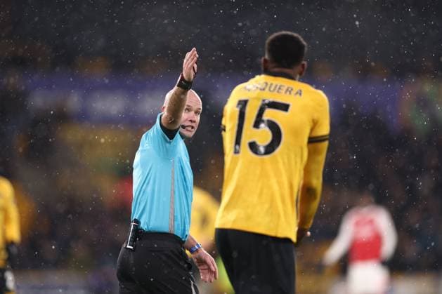 Referee Paul Tierney and Yerson Mosquera of Wolverhampton Wanderers Wolverhampton Wanderers v Arsenal, Premier League, Football, Molineux, Wolverhampton, UK - 18 Feb 2026Wolverhampton Molineux United Kingdom EDITORIAL USE ONLY No use with unauthorised audio, video, data, fixture lists, club league logos or live services. Online in-match use limited to 120 images, no video emulation. No use in betting, games or single club league player publications. Copyright: xRyanxBrowne Shutterstockx 16660426br