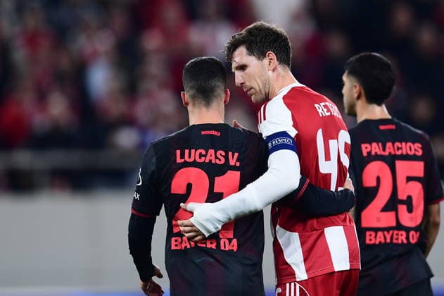UEFA Champions League - Olympiacos FC vs Bayer 04 Leverkusen - Panagiotis Retsos of Olympiacos FC reacts with Lucas Vazquez of Bayer 04 Leverkusen during the UEFA Champions League Play-Offs 1st leg soccer match between Olympiacos FC and Bayer 04 Leverkusen in Georgios Karaiskakis Stadium, Piraeus, Greece, on 18 February 2026. IMAGO ONE INCH PRODUCTIONS PIRAEUS GREECE Copyright: xONExINCHxPRODUCTIONSx 6859876