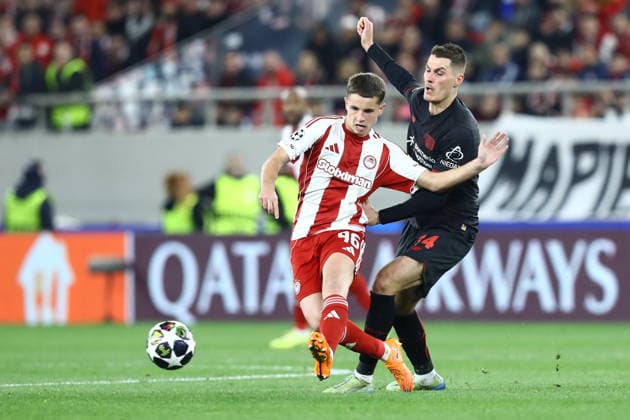 UEFA Champions League - Olympiacos FC vs Bayer 04 Leverkusen - Christos Mouzakitis of Olympiacos FC in action against Patrik Schick of Bayer 04 Leverkusen during the UEFA Champions League Play-Offs 1st leg soccer match between Olympiacos FC and Bayer 04 Leverkusen in Georgios Karaiskakis Stadium, Piraeus, Greece, on 18 February 2026. IMAGO ONE INCH PRODUCTIONS PIRAEUS GREECE Copyright: xONExINCHxPRODUCTIONSx 6859966
