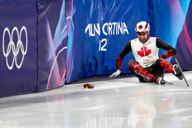 Maxime Laoun, 39, of Canada reacts after crashing during the Men s Short Track Speed skating, Eisschnelllauf 500m Finals at the Milano Figure skating, Eiskunstlauf Arena in Milan, Italy on Wednesday, February 18, 2026.  OLY20260218127 RICHARDxELLIS