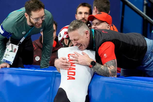 Steven Dubois, 4, of Canada celebrates after winning gold during the Men s Short Track Speed skating, Eisschnelllauf 500m Finals at the Milano Figure skating, Eiskunstlauf Arena in Milan, Italy on Wednesday, February 18, 2026. Melle van t Wout, 121, of Netherlands won silver and Jens van t Wout, 2, of Netherlands won bronze.  OLY20260218137 RICHARDxELLIS