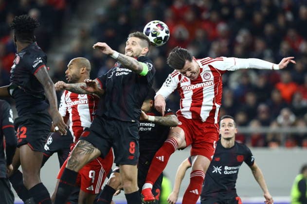 UEFA Champions League - Olympiacos FC vs Bayer 04 Leverkusen - Giulian Biancone of Olympiacos FC in action against Robert Andrich of Bayer 04 Leverkusen during the UEFA Champions League Play-Offs 1st leg soccer match between Olympiacos FC and Bayer 04 Leverkusen in Georgios Karaiskakis Stadium, Piraeus, Greece, on 18 February 2026. IMAGO ONE INCH PRODUCTIONS PIRAEUS GREECE Copyright: xONExINCHxPRODUCTIONSx 6859984