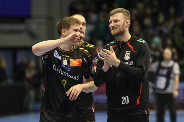 18 02 2026, xgox, Handball, EHF Champions League, SC Magdeburg GOG Handbold v l Manuel Zehnder Magdeburg, 8 , Philipp Weber Magdeburg, 20 Celebrating the victory, cheering after the end of the game Magdeburg