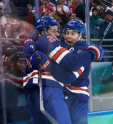 United States Dylan Larkin (21) and United States Charlie McAvoy (25) celebrate a goal in the second period of the Men s Hockey Playoff Quarter-final game between Sweden and the USA at the Milano Santagiulia Ice hockey, Eishockey Arena in Milan, Italy, on Wednesday, February 18, 2026.  OLY20260218330 AARONxJOSEFCZYK