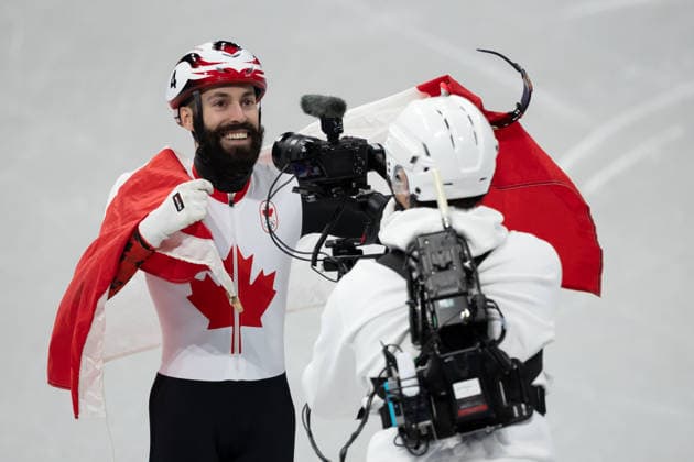February 18, 2026, Milano, Lombardy, Italy: Steven Dubois (4) of Canada celebrate winning the gold medal in the Short Track Speed skating, Eisschnelllauf Men 500m Final during the 2026 Winter Olympics at the Milano Ice Skating Arena on Wednesday in Milano. Milano Italy - ZUMAj89_ 20260218_oly_j89_017 Copyright: xPaulxKitagakixJr.x