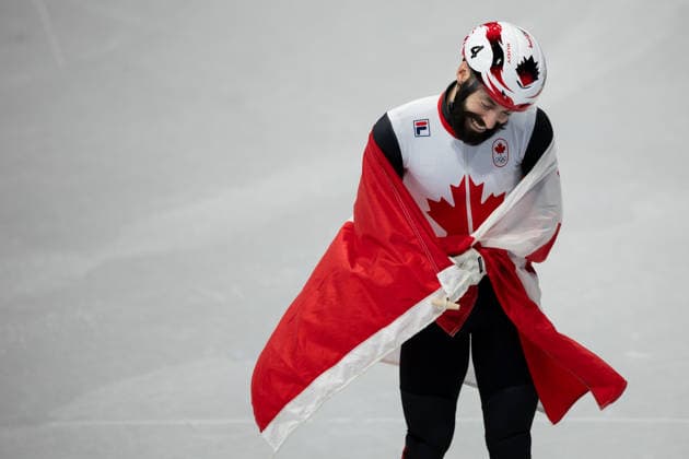 February 18, 2026, Milano, Lombardy, Italy: Steven Dubois (4) of Canada celebrate winning the gold medal in the Short Track Speed skating, Eisschnelllauf Men 500m Final during the 2026 Winter Olympics at the Milano Ice Skating Arena on Wednesday in Milano. Milano Italy - ZUMAj89_ 20260218_oly_j89_020 Copyright: xPaulxKitagakixJr.x