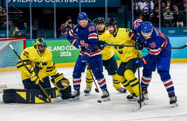 Sweden s Jacob Markstrom (25) and Sweden s Oliver Ekman-Larsson (3) defend as United States Matthew Tkachuk (19) and United States Jake Guentzel (59) attempt to score in the third period of the Men s Hockey Playoff Quarter-final game between Sweden and the USA at the Milano Santagiulia Ice hockey, Eishockey Arena in Milan, Italy, on Wednesday, February 18, 2026.  OLY20260218336 AARONxJOSEFCZYK