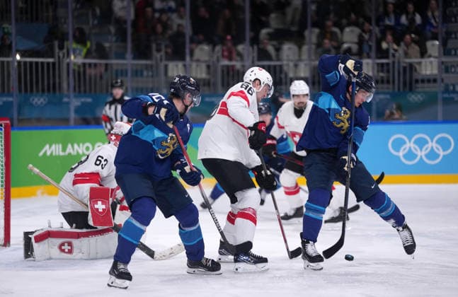 (260219) -- MILAN, Feb. 19, 2026 -- Players of both teams compete during the Ice hockey, Eishockey men s play-offs quarterfinal between Finland and Switzerland at the Milan-Cortina 2026 Olympic Winter games, Winterspiele,Spiele, Summer games in Milan, Italy, Feb. 18, 2026. ) (MICO2026)ITALY-MILAN-OLYMPIC WINTER GAMES-ICE HOCKEY-MEN-PLAY-OFFS QUARTERFINALS-FIN VS SUI TaoxXiyi 