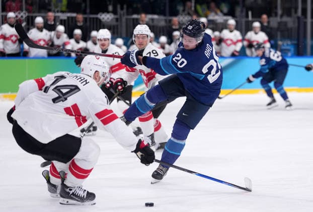 (260219) -- MILAN, Feb. 19, 2026 -- Sebastian Aho (front R) of Finland fights for the puck against Dean Kukan of Switzerland during the Ice hockey, Eishockey men s play-offs quarterfinal between Finland and Switzerland at the Milan-Cortina 2026 Olympic Winter games, Winterspiele,Spiele, Summer games in Milan, Italy, Feb. 18, 2026. ) (MICO2026)ITALY-MILAN-OLYMPIC WINTER GAMES-ICE HOCKEY-MEN-PLAY-OFFS QUARTERFINALS-FIN VS SUI TaoxXiyi 