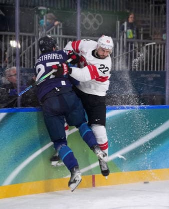 (260219) -- MILAN, Feb. 19, 2026 -- Eetu Luostarinen (L) of Finland fights for the puck against Nino Niederreiter of Switzerland during the Ice hockey, Eishockey men s play-offs quarterfinal between Finland and Switzerland at the Milan-Cortina 2026 Olympic Winter games, Winterspiele,Spiele, Summer games in Milan, Italy, Feb. 18, 2026. ) (MICO2026)ITALY-MILAN-OLYMPIC WINTER GAMES-ICE HOCKEY-MEN-PLAY-OFFS QUARTERFINALS-FIN VS SUI TaoxXiyi 
