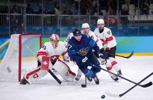 (260219) -- MILAN, Feb. 19, 2026 -- Finland s Niko Mikkola (front) competes during the Ice hockey, Eishockey men s play-offs quarterfinal between Finland and Switzerland at the Milan-Cortina 2026 Olympic Winter games, Winterspiele,Spiele, Summer games in Milan, Italy, Feb. 18, 2026. ) (MICO2026)ITALY-MILAN-OLYMPIC WINTER GAMES-ICE HOCKEY-MEN-PLAY-OFFS QUARTERFINALS-FIN VS SUI TaoxXiyi 