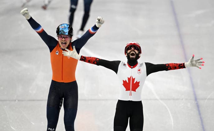 (260219) -- MILAN, Feb. 19, 2026 -- Steven Dubois (R) of Canada and Melle van t Wout of the Netherlands celebrate after finishing the short track Speed skating, Eisschnelllauf men s 500m final A at the Milan-Cortina 2026 Olympic Winter games, Winterspiele,Spiele, Summer games in Milan, Italy, Feb. 18, 2026. ) (MICO2026)ITALY-MILAN-OLYMPIC WINTER GAMES-SHORT TRACK SPEED SKATING-MEN S 500M-FINALS ChengxMin 